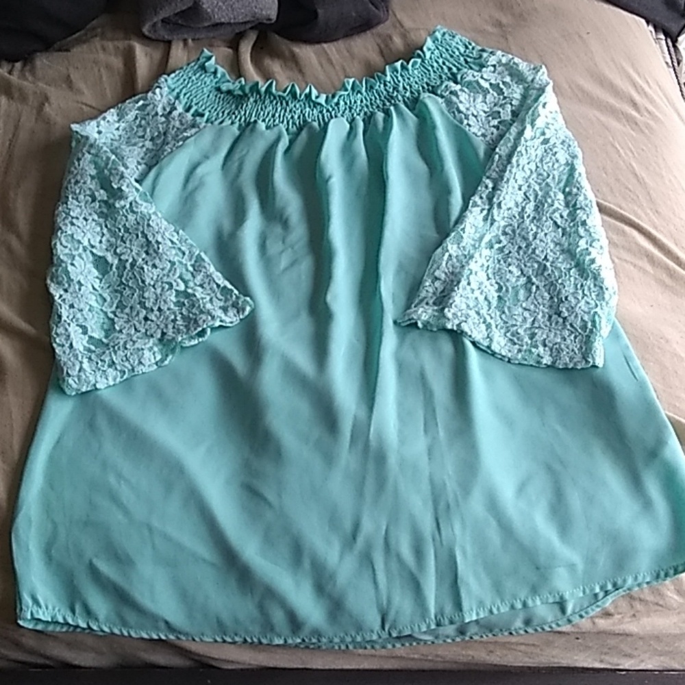 Green turquoise blouse lace fabric.